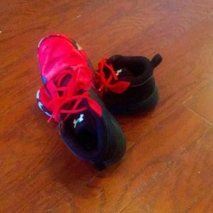 I’m selling a size five adidas that are red and black